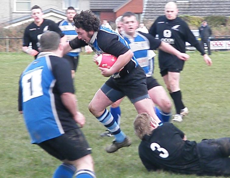 Randall Williams tackled by Mark Smith